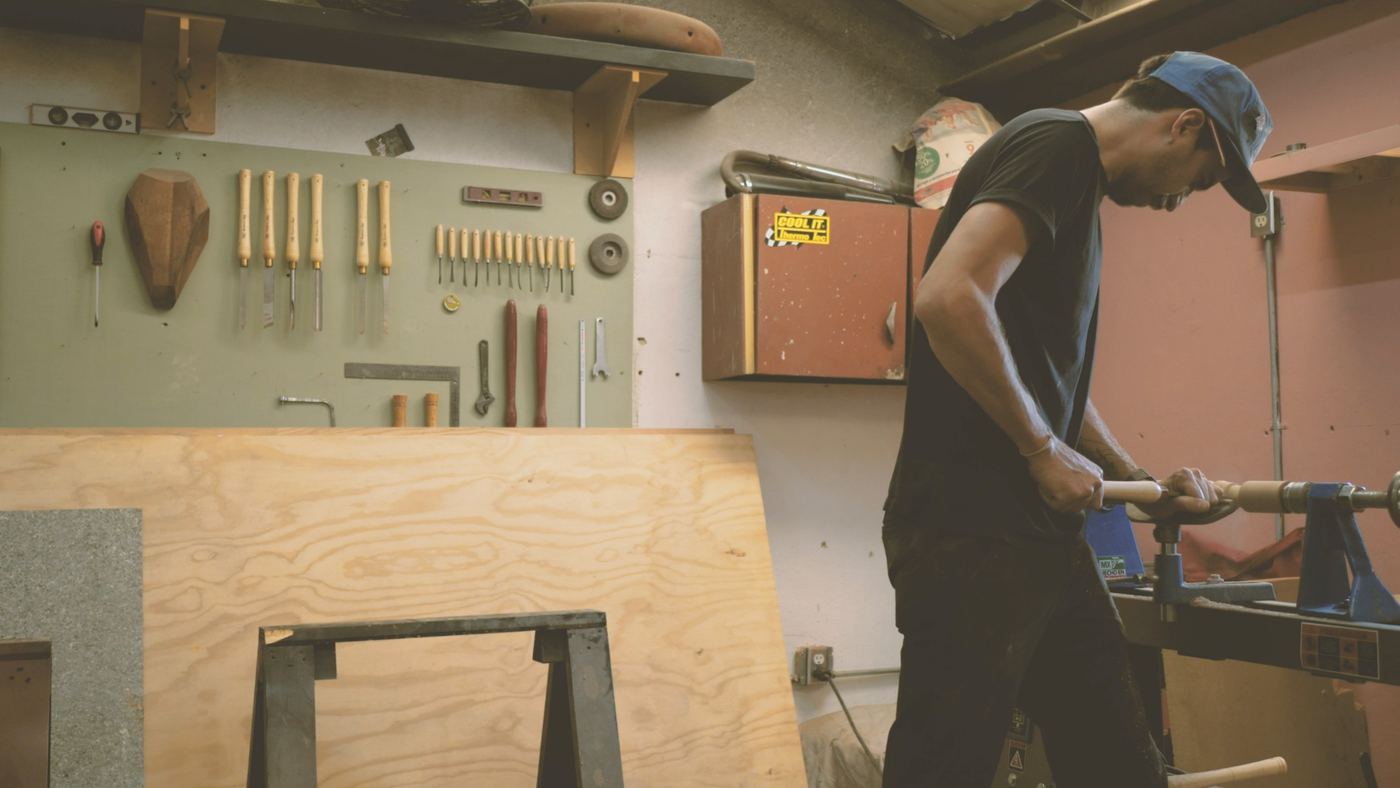 A carpenter working in a wood shop